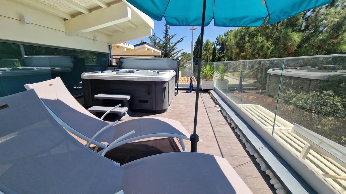 Sun loungers beside the jacuzzi